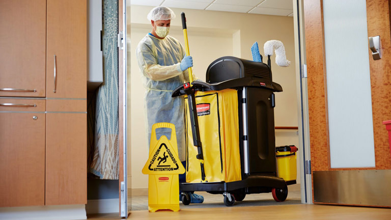 Workers spotted using High Security Janitor Cart and "Caution Wet Floor" Sign