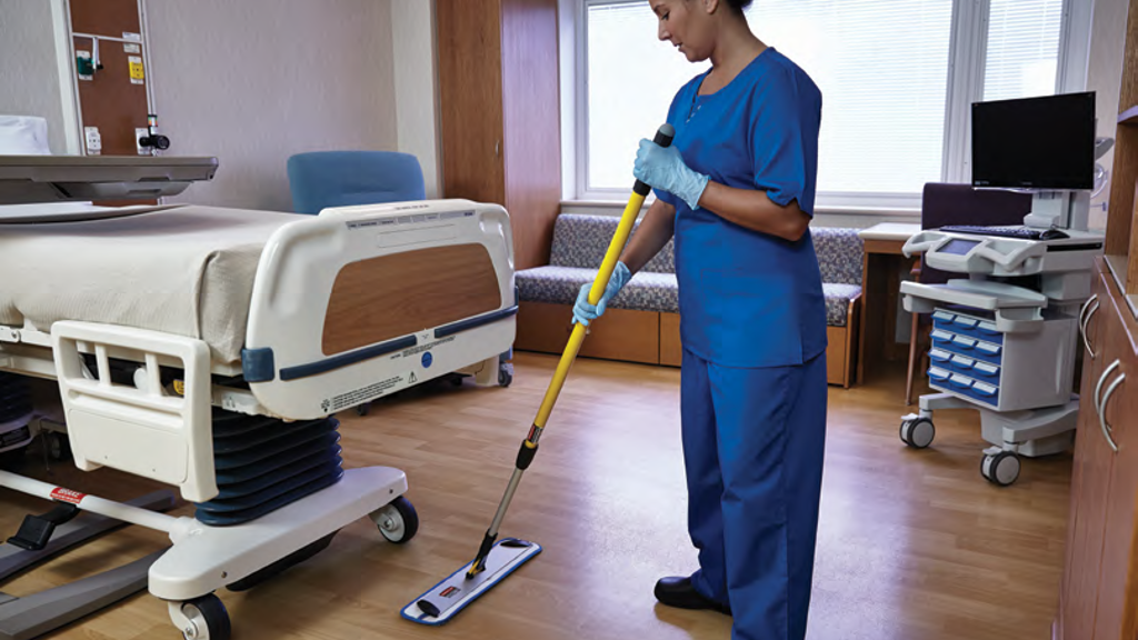 A person cleaning a floor on a hospital ward with a HYGEN™ PUlSE™ Microfibre Mop Kit