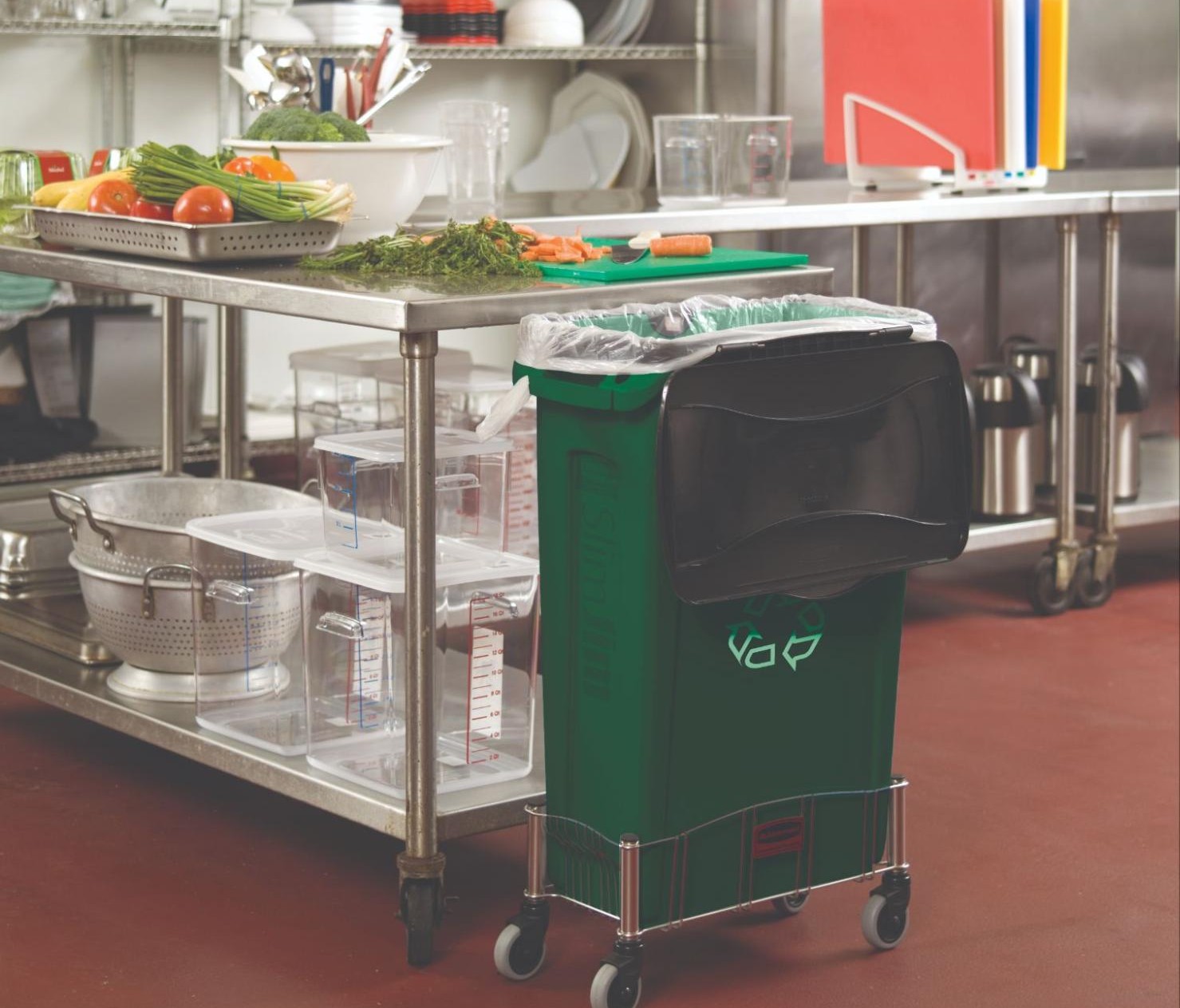 Rubbermaid Commercial Products Slim Jim trash can on a stainless steel mobile dolly