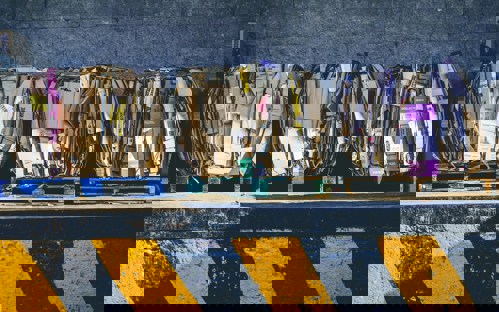 Compressed cardboard waste on wooden pallets